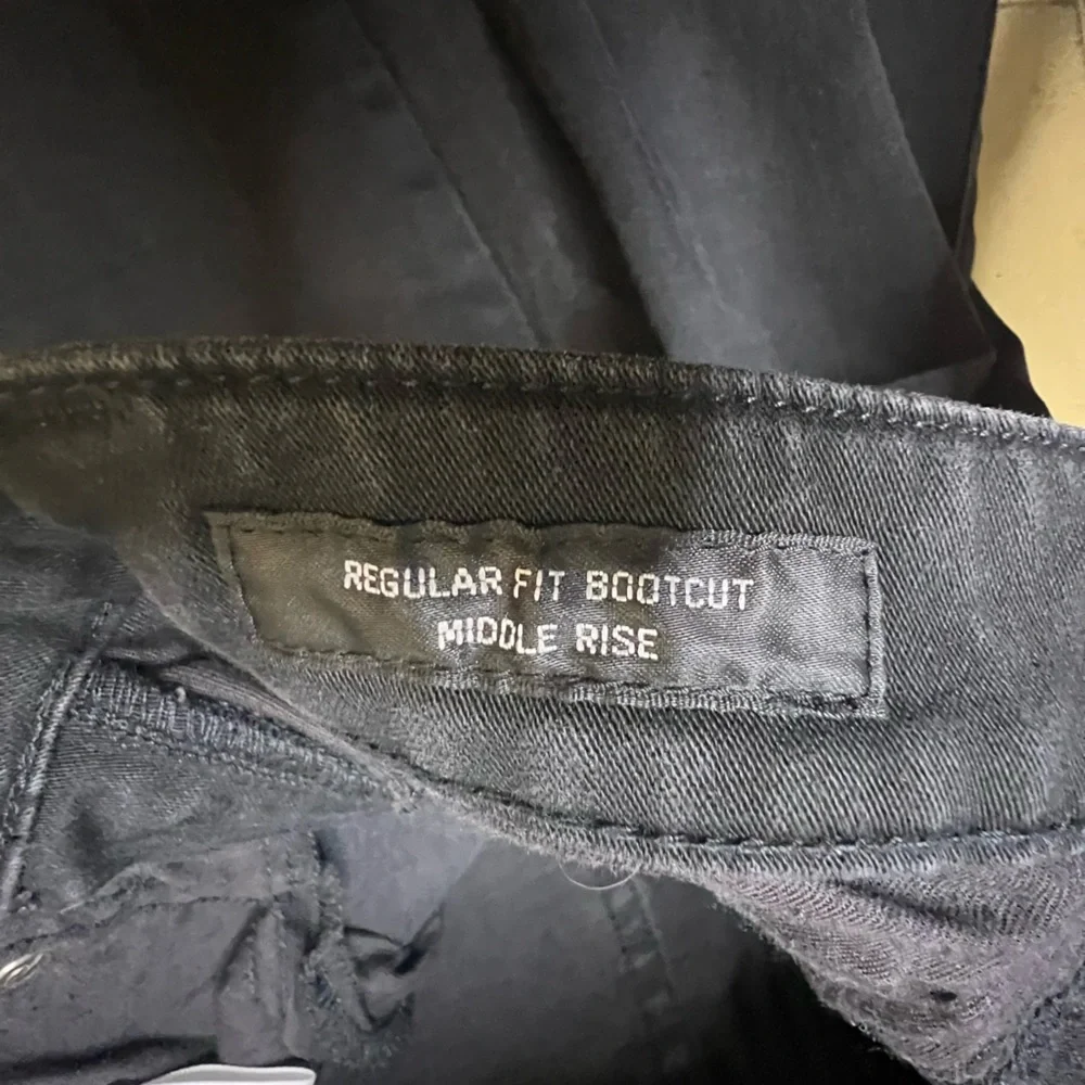 Uniqlo Mid Rise Boot Cut Jeans - Picture 5 of 12